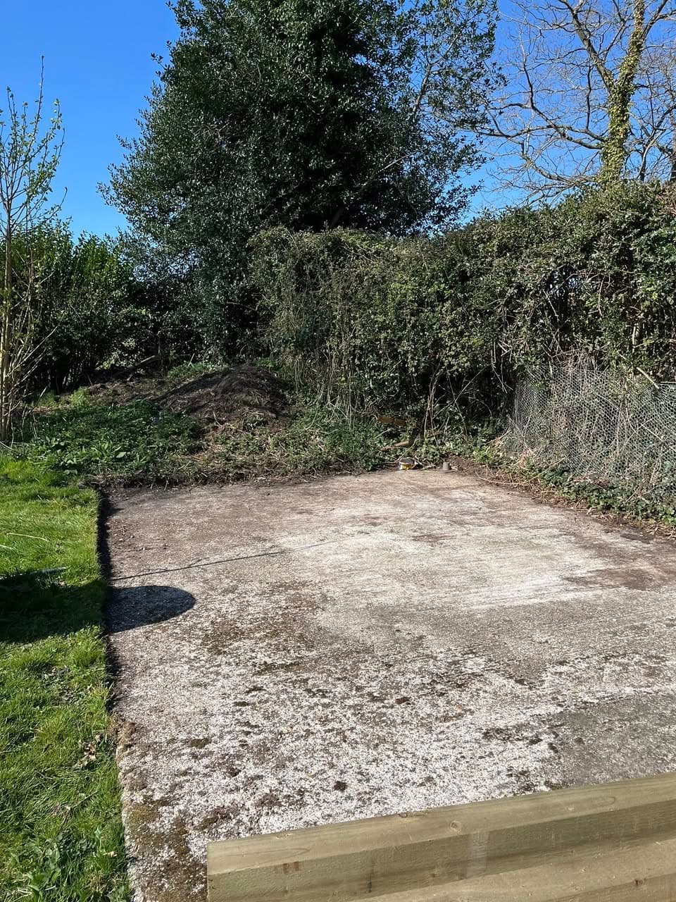 Newly laid concrete base with timber edging