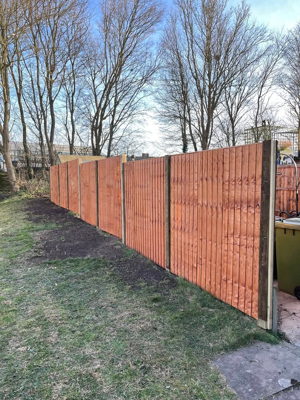 Newly installed closeboard fencing with concrete posts